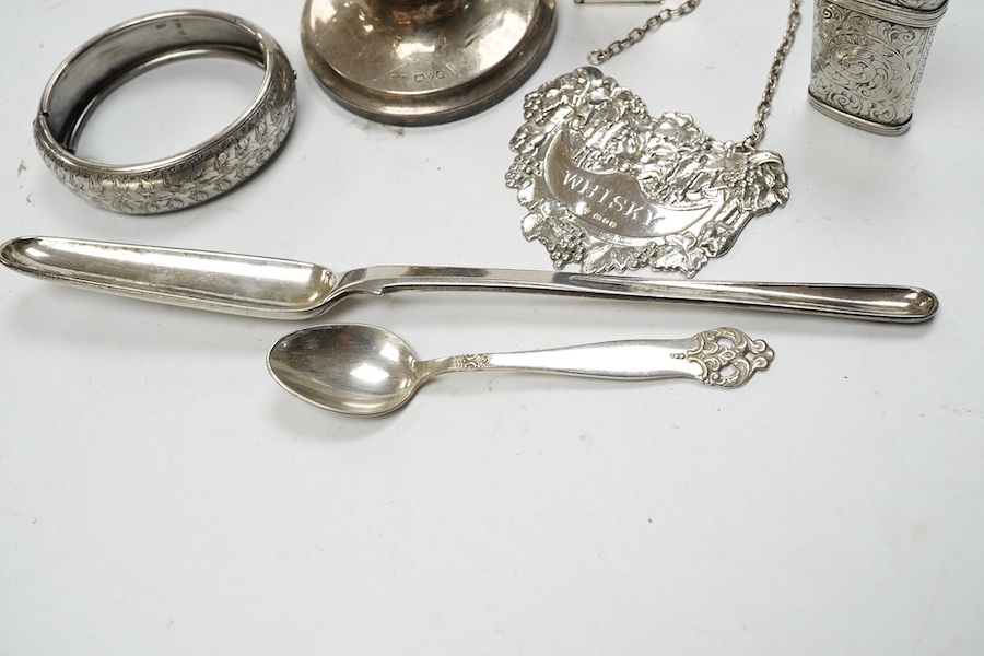 A late George III silver marrow scoop, Eley & Fearn, London, 1818, 21.6cm, a sterling double ended pill box, a Victorian silver etui case and four other items including an inkwell, wine label and plated spoon. Condition